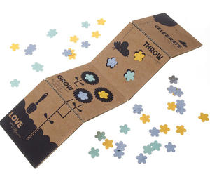 撒出、種下：夾有種子的花型紙屑